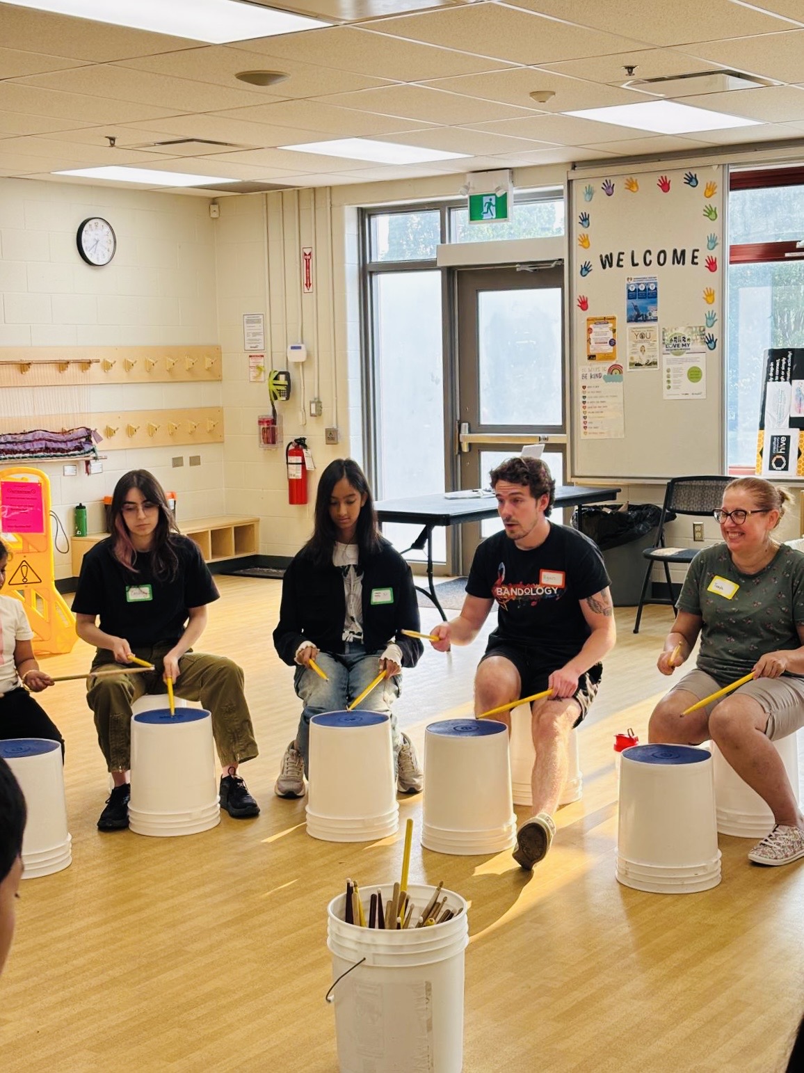 A guest instructor leading the group through a rhythm.
