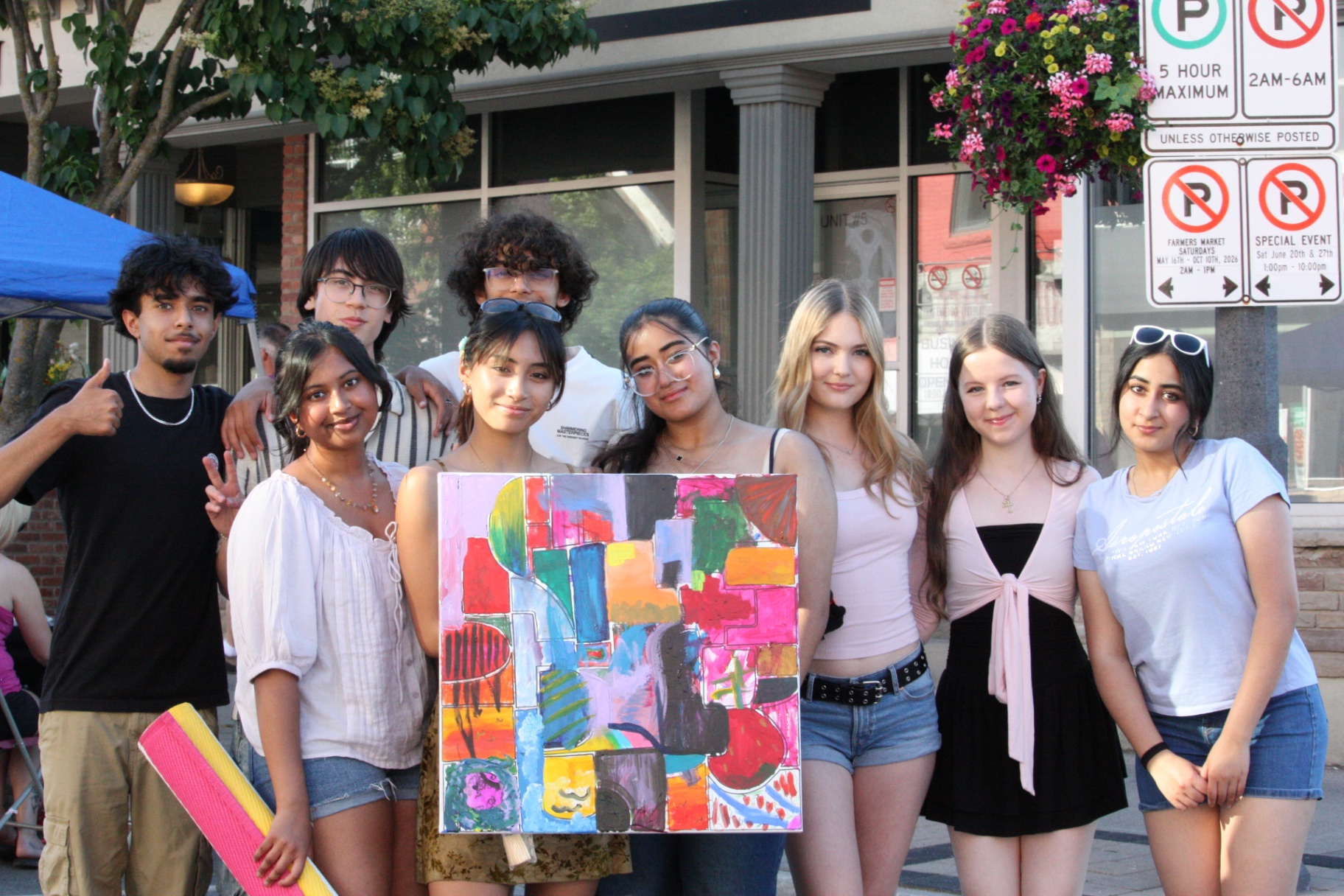 The Mosaic Bridge team with the finished collaborative canvas.